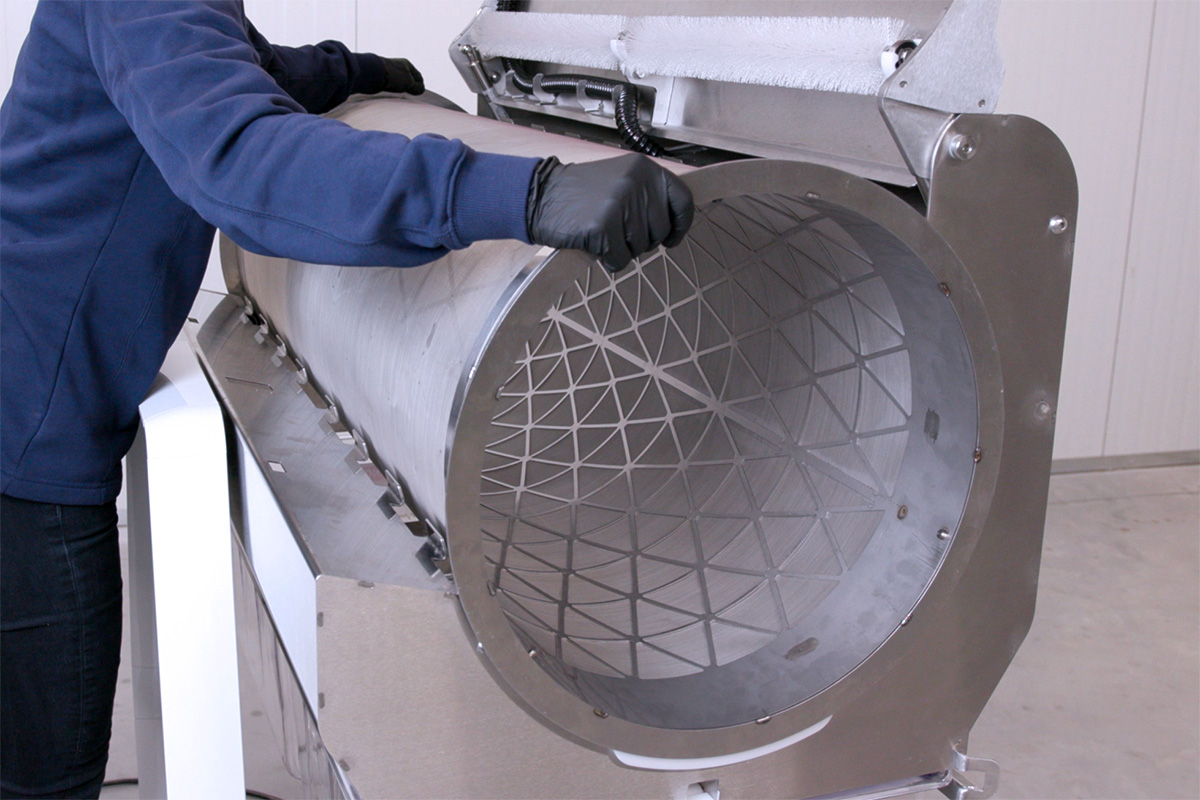 MD48_kief-tumbler operator setting the MD48 kief tumbler in place