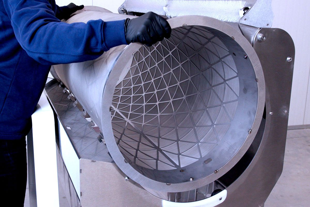 MD48 Kief Tumbler being loaded into the MD48 machine.