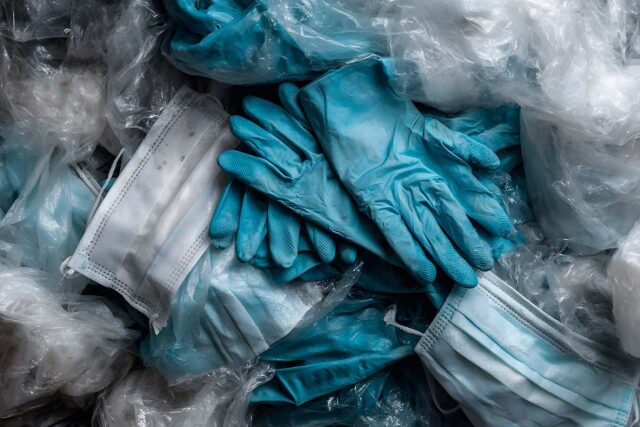 pile of gloves and masks